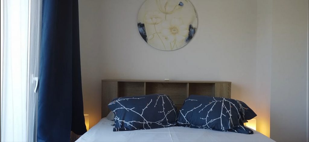 Bedroom with blue bedding at a vacation rental in Figueira da Foz
